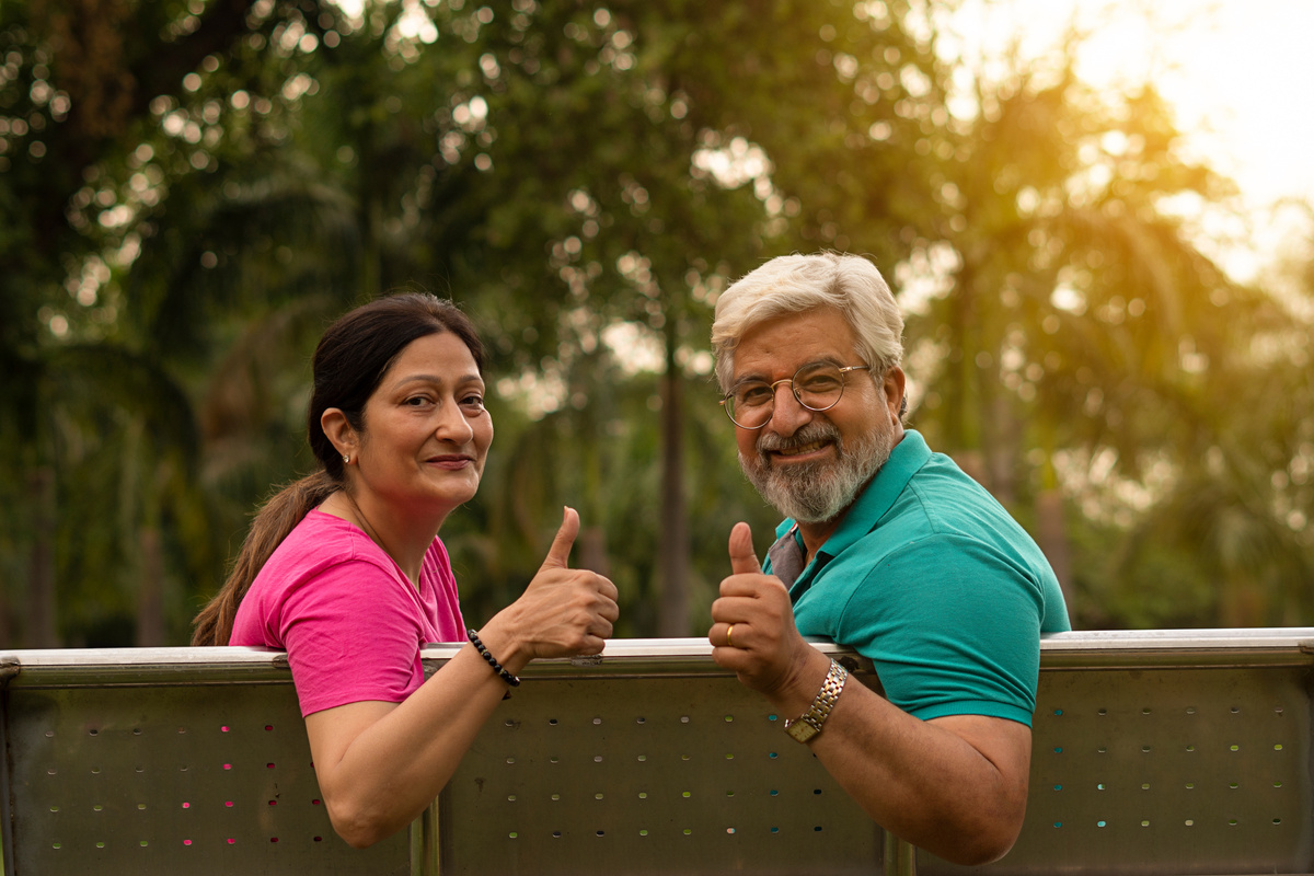 Happy senior citizen couple in park